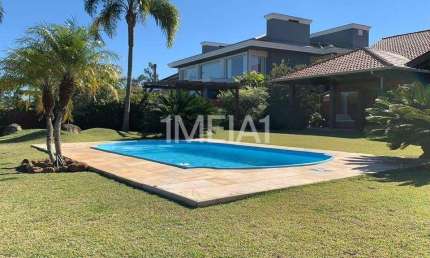 Casa em condomínio fechado com 4 quartos para alugar na Avenida Juca Batista, 8000, Belém Novo, Porto Alegre por R$ 19.800