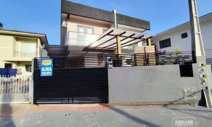 Casa com 3 dormitórios para alugar, 128 m² por R$ 3.356,49/mês - Potecas - São José/SC