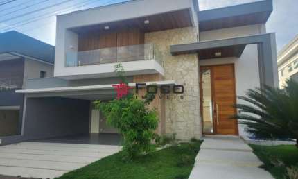 Casa com 4 suítes, 450m² por R$ 3.150.000,00 - Condomínio Residencial Jaguary