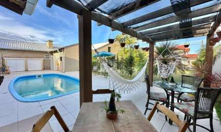 Casa com 5 quartos à venda na Das Rosas, 4176, Capão Novo, Capão da Canoa por R$ 1.000.000