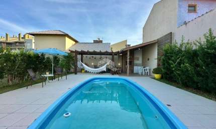 Casa com 5 quartos à venda na Das Rosas, 4176, Capão Novo, Capão da Canoa por R$ 1.000.000