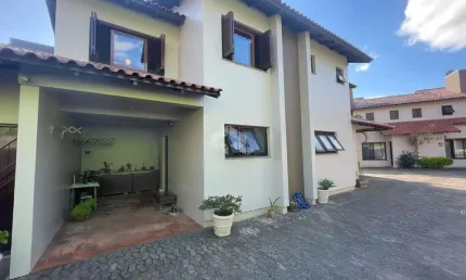 Casa em condomínio fechado com 3 quartos à venda na Rua Santa Helena, 60, Centro, Canoas por R$ 594.000