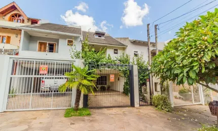 Casa 3 dorms à venda Rua Cláudio da Silva Pinto, Guarujá - Porto Alegre