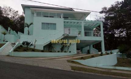 Casa de Alto Padrão com 4 Suítes, Cozinha Americana e Piscina á venda na reserva de Ibirapitanga Arujá divisa com Santa Isabel-SP