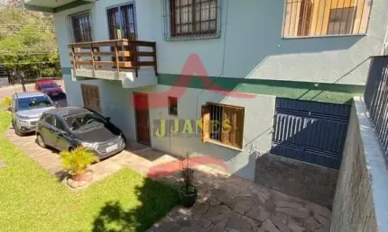 Casa com 4 quartos à venda na Rua Açores, 776, Tarumã, Viamão por R$ 1.000.000
