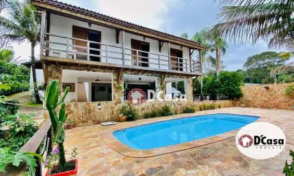 Casa a venda no condomínio Chácaras Cataguá, com área total de 2201m2, 4 quartos e ampla área gourmet com piscina, Taubaté-SP.
