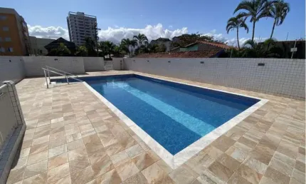 Apartamento na praia com 3 quartos, piscina e área gourmet em Peruíbe.