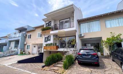 Casa em condomínio fechado com 3 quartos à venda na Rua Deputado Hugo Mardini, 1780, Passo das Pedras, Porto Alegre por R$ 1.200.000