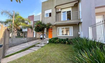 Casa em condomínio fechado com 3 quartos à venda na Rua Wilma Perpétuo, 40, Mário Quintana, Porto Alegre por R$ 740.000