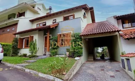 Casa em condomínio fechado com 3 quartos à venda na Avenida Vicente Monteggia, 2000, Cavalhada, Porto Alegre por R$ 790.000