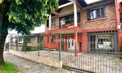 Sobrado com 4 dormitórios à venda, 261 m² por R$ 620.000 - Nossa Senhora das Graças - Canoas/RS