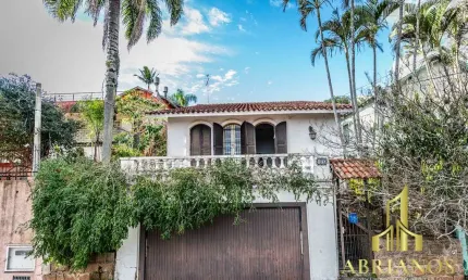 Casa com 3 quartos à venda na rua oscar tollens, 170, santa tereza, porto alegre por r$ 450.000