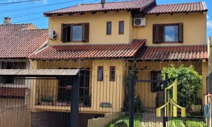 Casa com 3 quartos à venda na rua doutor mário totta, 2812, tristeza, porto alegre por r$ 870.000