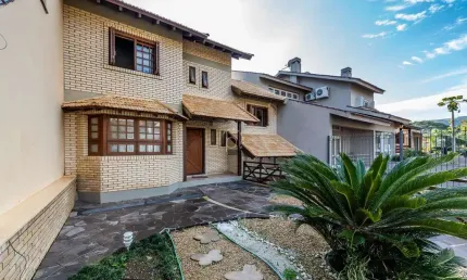 Casa com 4 quartos à venda na rua lloyd de andrade polidoro, 60, ipanema, porto alegre por r$ 1.250.000