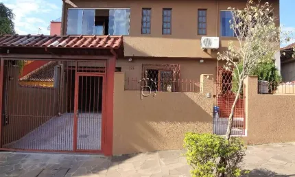Casa com 4 quartos à venda na rua adroaldo novo correa, 126, cavalhada, porto alegre por r$ 750.000