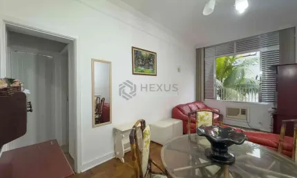 Apartamento com vista livre a uma quadra da praia das pitangueiras de 2 quartos (1 suíte) com 1 vag