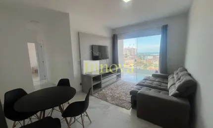 Apartamento novo à venda, com dois dormitórios sendo uma suíte, a 400m da orla do indaiá, em caragu
