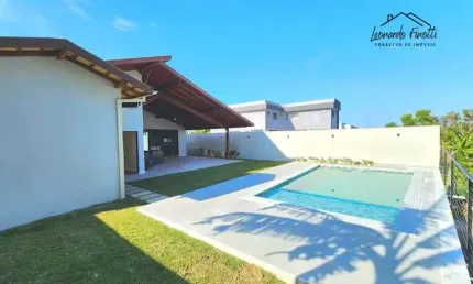 Casa linear com 4 suítes condomínio arquipélago de manguinhos