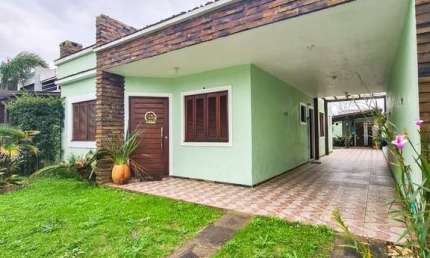 Casa com 3 quartos à venda na Rua Paulo Celestino Franco, 64, Guarani, Capão da Canoa por R$ 680.000