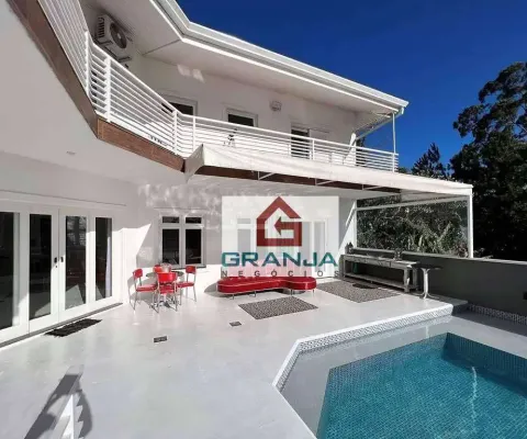 Majestosa residência que  ostenta um verdadeiro exemplo de sofisticação e elegância. localizada em um cenário único, com uma vista cinematográfica.