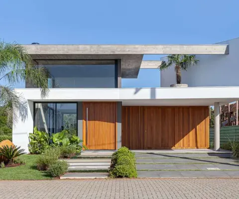 Casa à venda no bairro condomínio reserva das águas - torres/rs