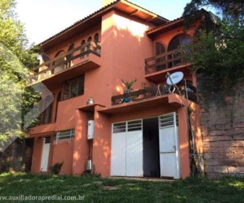 Casa em condomínio fechado com 4 quartos à venda na Rua Amapá, 836, Vila Nova, Porto Alegre