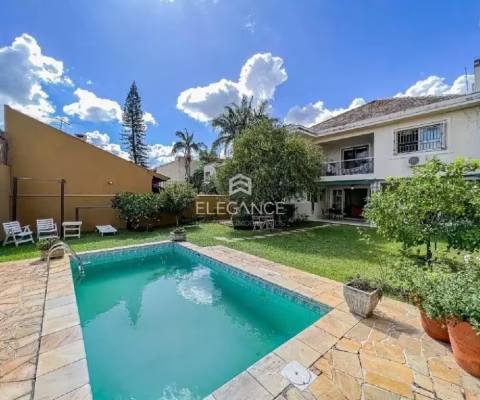 Elegance Imóveis vende ótima residência com 362 m2, 4 dormitórios , 3 suítes, piscina,  com 2 vagas garagem. Chácara das Pedras Porto Alegre.
