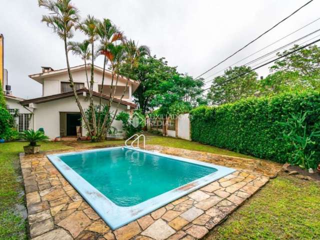 Casa com 2 quartos à venda na Rua Fábio Coelho de Magalhães, 115, Serraria, Porto Alegre, 200 m2 por R$ 559.000
