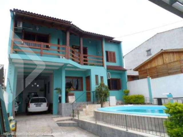 Casa em condomínio fechado com 3 quartos à venda na CYRO MARTINS, 123, Mário Quintana, Porto Alegre, 156 m2 por R$ 449.000