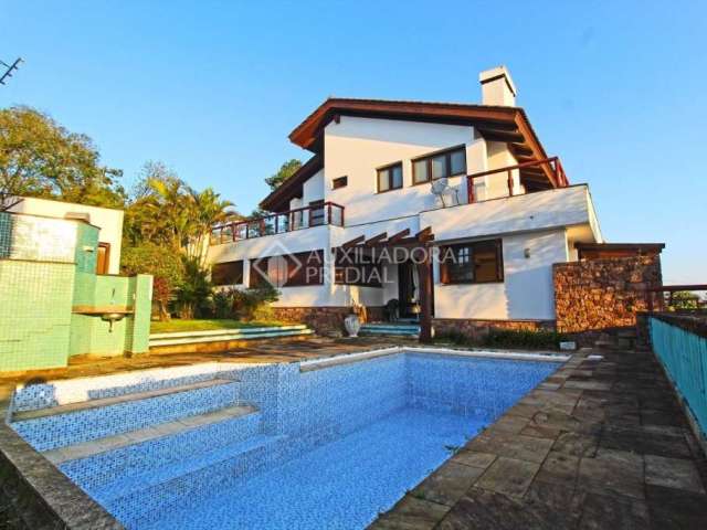 Casa com 3 quartos à venda na Rua Dona Lida Monteiro, 180, Teresópolis, Porto Alegre, 600 m2 por R$ 1.890.000