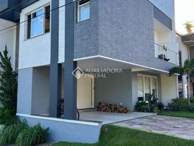 Casa em condomínio fechado com 3 quartos à venda na Rua Ivo Walter Kern, 599, Hípica, Porto Alegre, 260 m2 por R$ 1.350.000