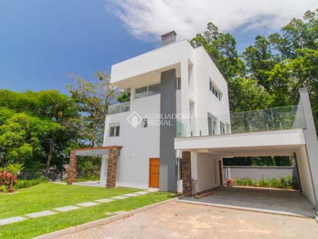 Casa em condomínio fechado com 3 quartos para alugar na Avenida Coronel Marcos, 1239, Pedra Redonda, Porto Alegre, 335 m2 por R$ 29.900