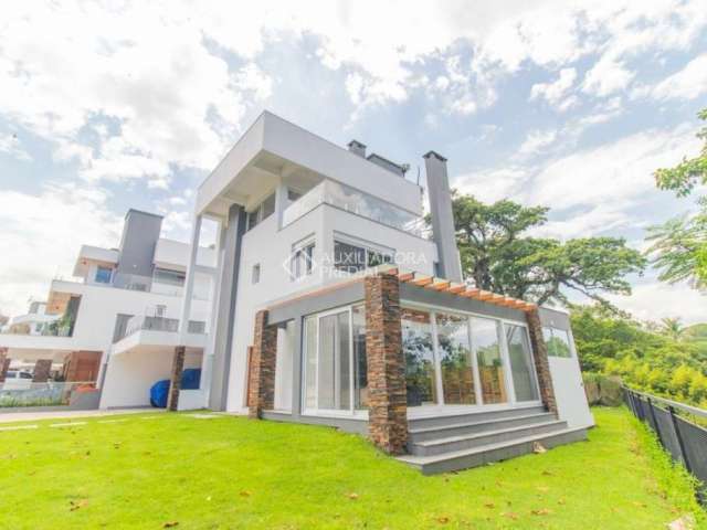 Casa em condomínio fechado com 3 quartos para alugar na Avenida Coronel Marcos, 1239, Pedra Redonda, Porto Alegre, 335 m2 por R$ 29.900