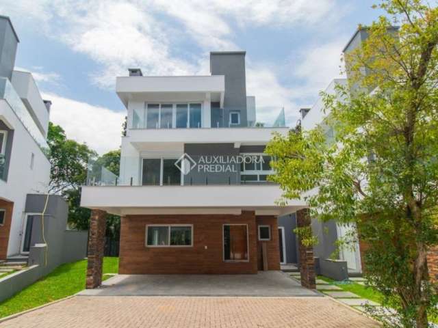 Casa em condomínio fechado com 3 quartos para alugar na Avenida Coronel Marcos, 1239, Pedra Redonda, Porto Alegre, 300 m2 por R$ 18.000