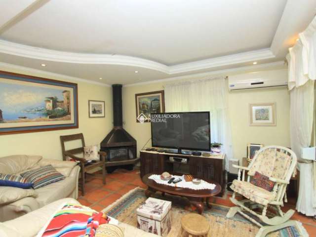 Casa em condomínio fechado com 2 quartos à venda na Estrada Capitão Gentil Machado de Godoy, 4500, Vila Elsa, Viamão, 124 m2 por R$ 780.000