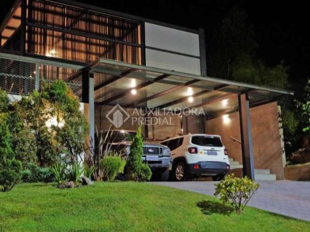 Casa em condomínio fechado com 3 quartos à venda na Avenida Senador Salgado Filho, 8500, Jardim Krahe, Viamão, 181 m2 por R$ 980.000