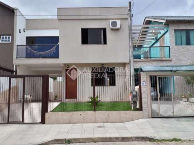 Casa em condomínio fechado com 3 quartos à venda na Rua Sol Nascente, 385, Lomba do Pinheiro, Porto Alegre, 142 m2 por R$ 440.000
