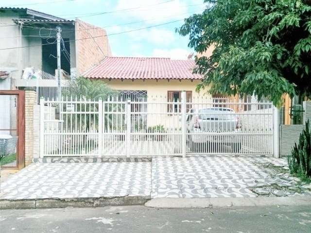 Casa com 3 quartos à venda na Rua Biguás, 704, Jardim Algarve, Alvorada, 67 m2 por R$ 398.000