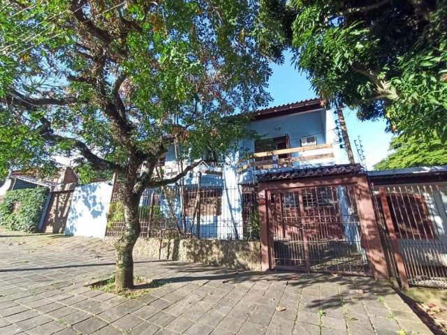 Casa com 4 quartos à venda na Avenida Cruz Alta, 110, Nonoai, Porto Alegre, 419 m2 por R$ 2.000.000