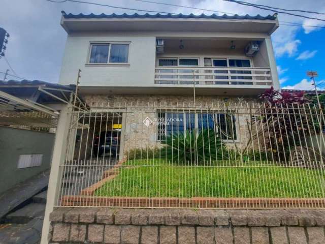 Casa com 4 quartos à venda na Rua Ibirubá, 232, Cavalhada, Porto Alegre, 250 m2 por R$ 750.000