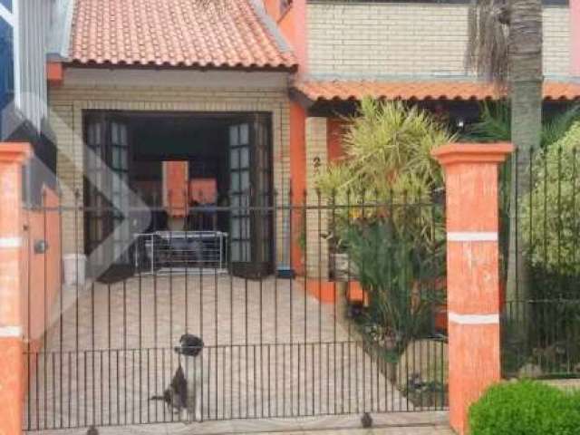 Casa em condomínio fechado com 3 quartos à venda na Rua Cisne, 202, Jardim Algarve, Alvorada, 130 m2 por R$ 420.000