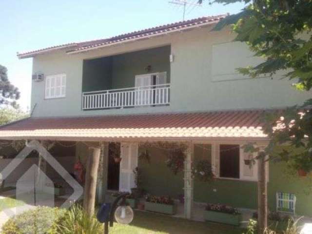 Casa em condomínio fechado com 4 quartos à venda na Rua Francisco Machado, 390, Tijuca, Alvorada, 310 m2 por R$ 640.000