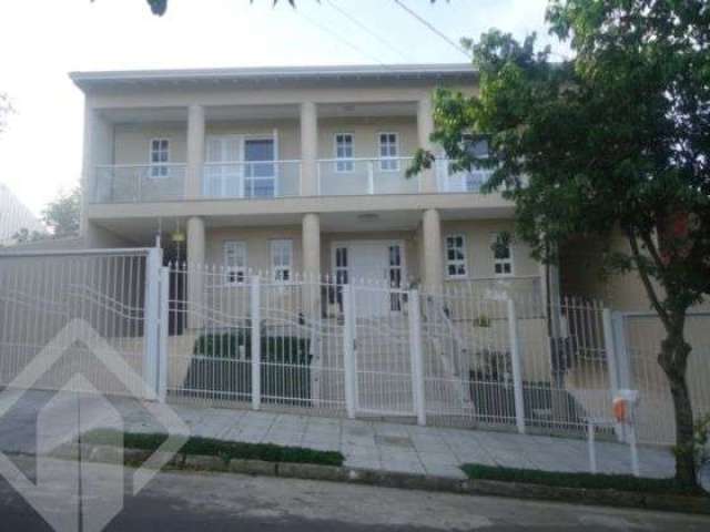 Casa em condomínio fechado com 5 quartos à venda na Rua Colibris, 949, Jardim Algarve, Alvorada, 487 m2 por R$ 932.000