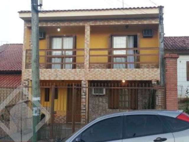 Casa em condomínio fechado com 4 quartos à venda na Rua dos Cardeais, 130, Jardim Algarve, Alvorada, 166 m2 por R$ 400.000