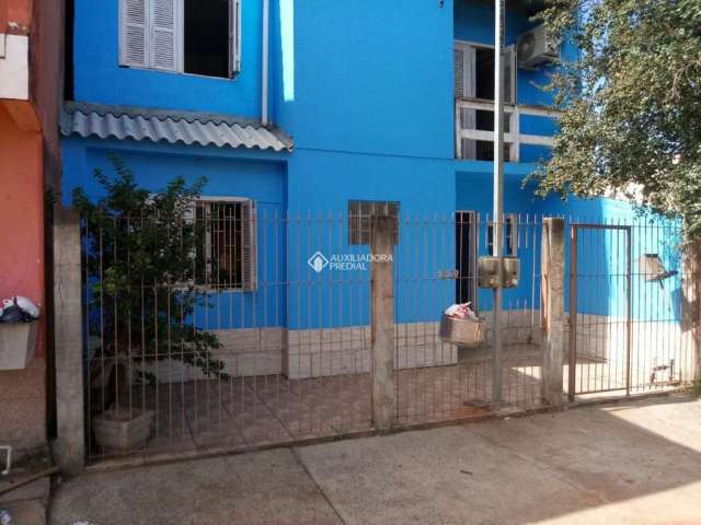 Casa com 3 quartos à venda na Rua Cento e Vinte e Um, 228, Jardim Algarve, Alvorada, 80 m2 por R$ 250.000