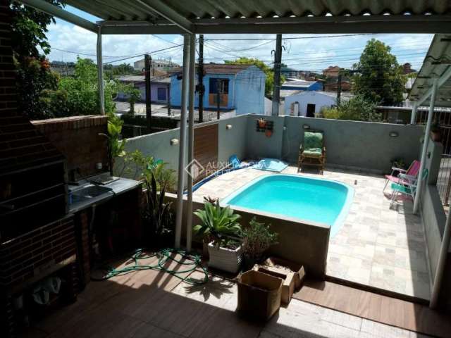 Casa com 3 quartos à venda na Gralhas, 131, Jardim Algarve, Alvorada, 113 m2 por R$ 310.000