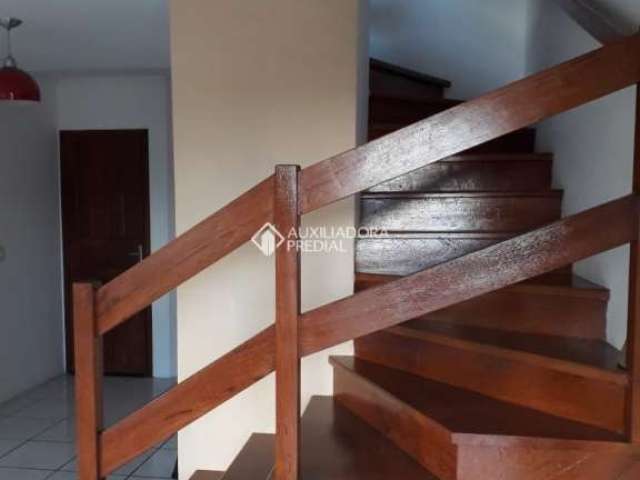 Casa em condomínio fechado com 2 quartos à venda na Rua Ângelo Silveiro, 78, Santa Isabel, Viamão, 70 m2 por R$ 210.000