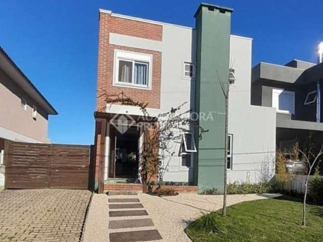 Casa em condomínio fechado com 3 quartos à venda na Avenida Senador Salgado Filho, 8500, Jardim Krahe, Viamão, 220 m2 por R$ 1.170.000