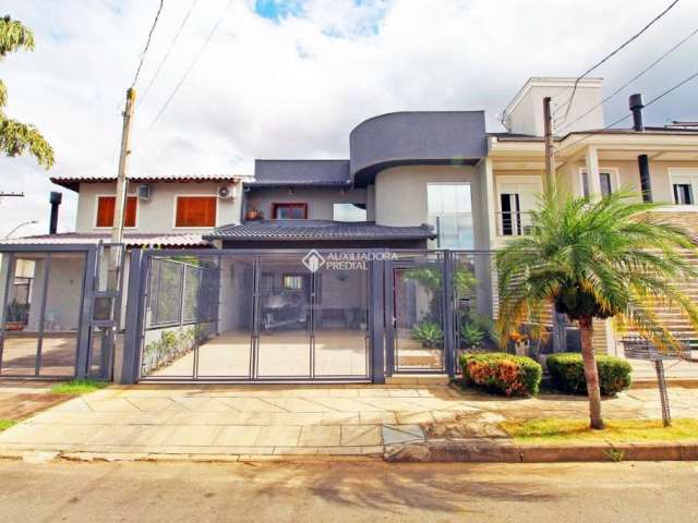 Casa em condomínio fechado com 4 quartos à venda na Rua Ângelo Raphael Frizzo, 95, Mário Quintana, Porto Alegre, 216 m2 por R$ 920.000