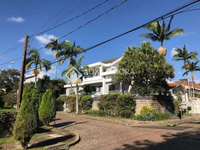 Casa em condomínio fechado com 5 quartos à venda na Rua Desembargador Hugo Candal, 230, Três Figueiras, Porto Alegre, 470 m2 por R$ 2.450.000